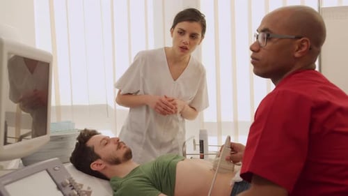 Medical Professional Performs Ultrasound Examination on Patient