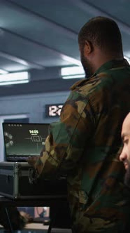Adults Working on Laptop in a Futuristic Office