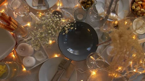 Festive Table Setting with Candles and Food