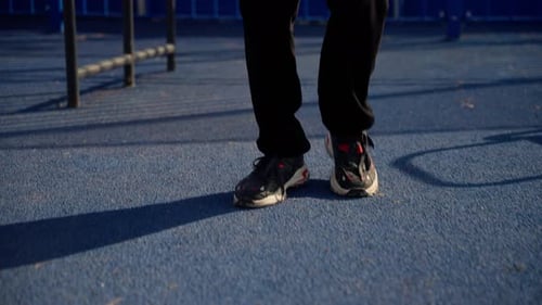 Slow Motion Basketball Dribbling on Blue Outdoor Court in Daylight