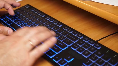 21Hands working on laptop with keyboard and mouse on wooden desk, concept of technology, internet, d