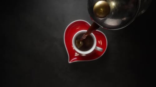 Coffee Pouring into Mug with Heart Saucer