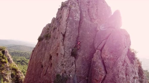 Climbing woman in the mountain. Drone view of climber sportsmen.Physical activity in the countryside