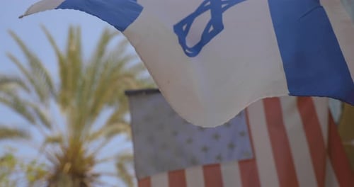 Israeli Flag and American Flag Waving in Wind