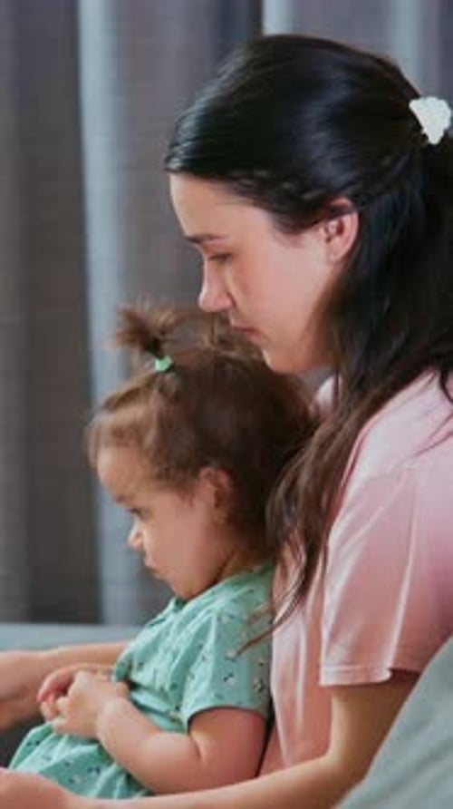 Loving Mother Holding Daughter in Her Arms