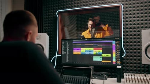 young pop rap artist emotionally recording a new song in a professional recording studio sound