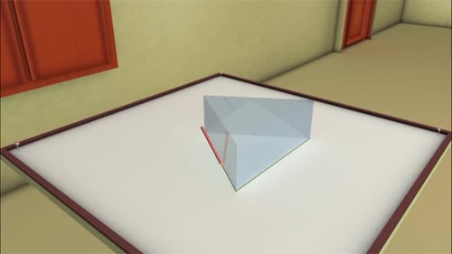 Glass prism demonstrating light refraction on white table