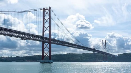 Timelapse of the 25th of April Bridge and the Tejo river in Lisbon, Portugal. Close up of the bridge