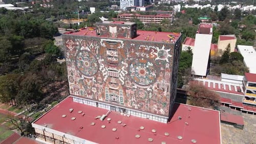 Orbiting drone shot of a library at University City, Mexico.