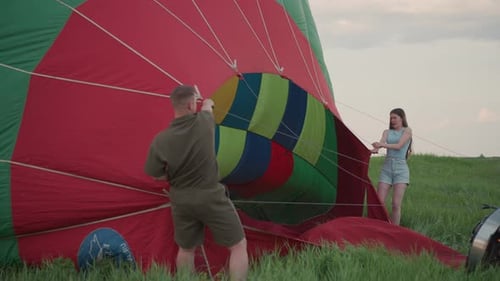 Man and Woman Inflating a Hot Air Balloon