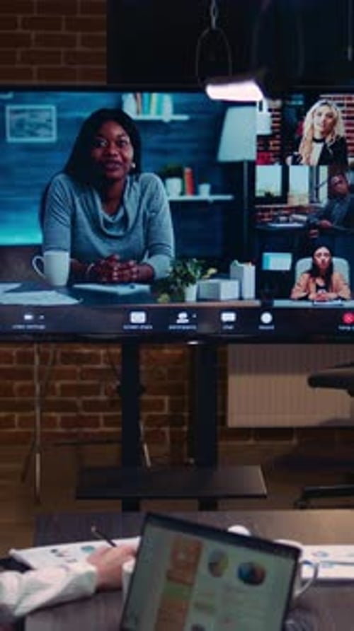 Online Team Meeting on Large Screen in Office