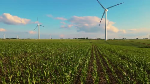 Renewable Wind Energy Through Electricity Generator Rotating Windmill in Scenic Countryside Farm