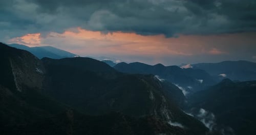 Timelapse of Mountain Sunset Landscape with Rainy Clouds in Sky on Travel Path