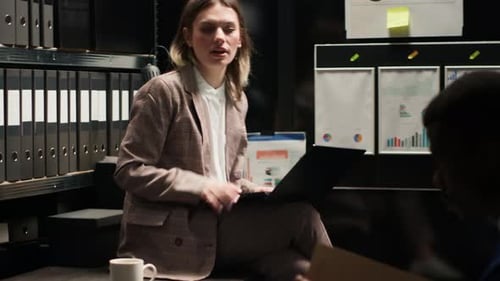 Business Professionals Working Together on a Laptop