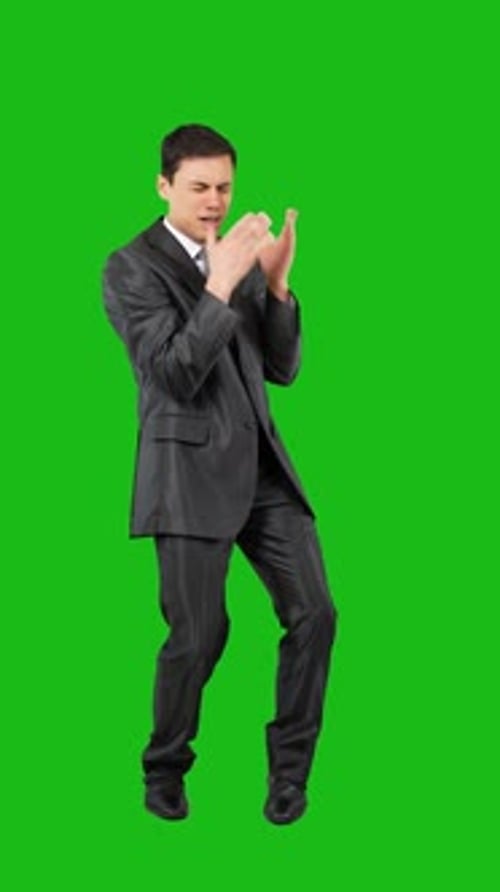 Amazed Man Pointing Aside in Studio Chroma Key