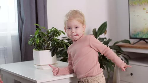 A Girl with a Cochlear Implant Watches TV and Hears Sounds