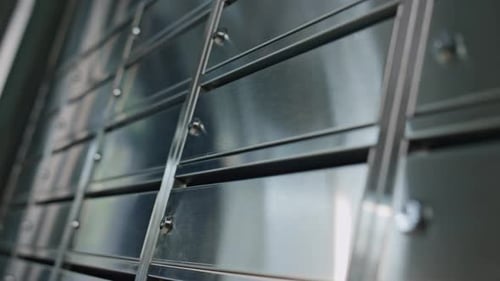 Closeup Metal Post Lockers Reflecting Light Closed Contemporary Mailbox Indoors