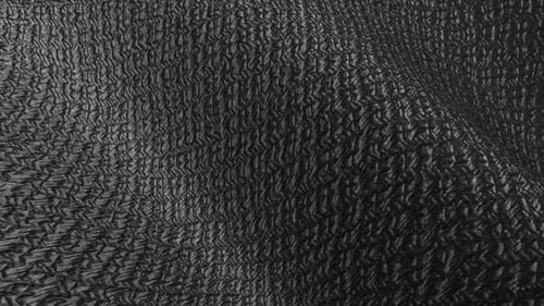 Matte black grid texture waves shaping an elegant premium background with subtle form