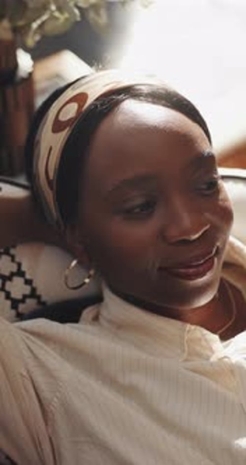 Relax, thinking and black woman on sofa, above and smile with ideas, resting and daydreaming Home