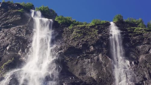 A breathtaking view of the Seven Sisters waterfalls in the Geiranger fjord, Norway. Water falling fr