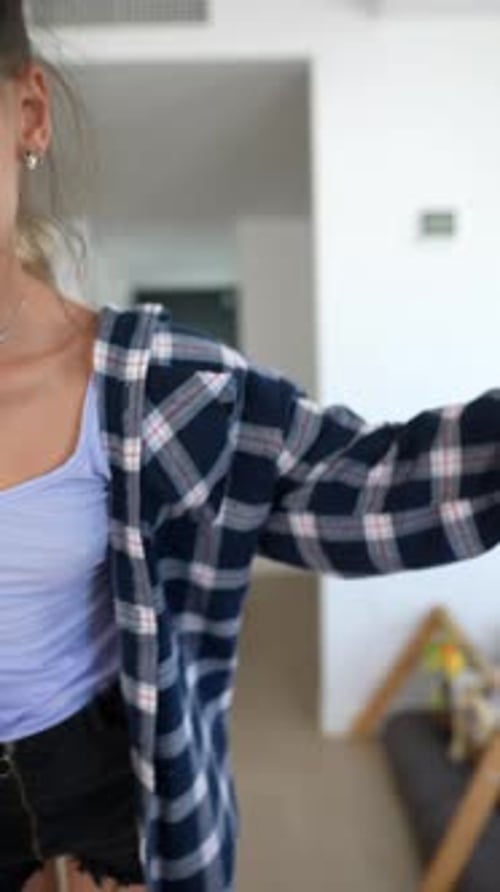 Expressive Dance by Young Woman in Modern Apartment