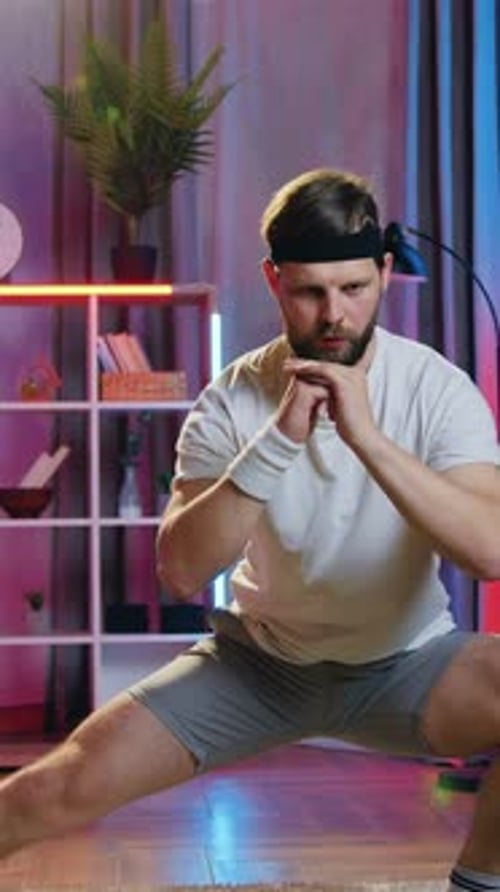 Man Doing Side Lunges for Home Fitness Workout