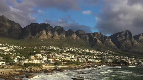 Flight over Cape Town's Camps Bay Beach with Table Mountain in the Background at Sunset