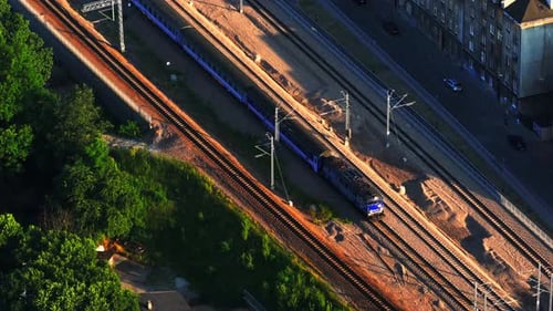 Train Traveling on Steel Bridge Entering the City