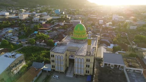 Aerial view of the Mosque in the city center at sunset