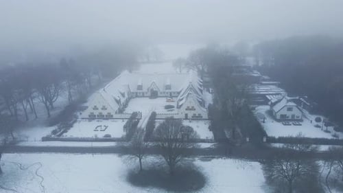 Aerial of beautiful old farm building in a rural area in winter