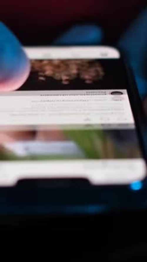 Hand Scrolls Through Phone Images