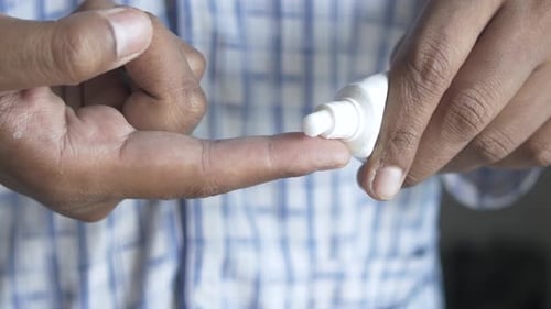 Man Applying Antibiotic Cream Close Up