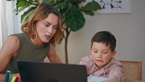 Mother Helping Child Studying at Home Closeup School Boy Looking Laptop Screen