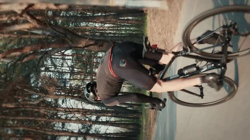 Male cyclist riding on bicycle, doing intense cycling intervals. Vertical video