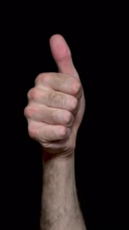 Arm and Hand Giving Thumbs Up Gesture