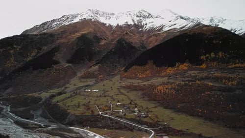 Village Located on the Slope Surrounded By Snow Capped Peaks Deep Gorges and Rugged Cliffs