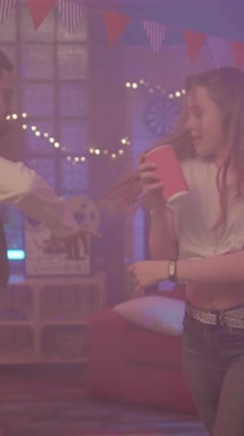 Woman Dancing at an Indoor House Party