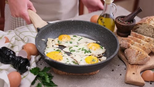 Cooking Fried Eggs for Breakfast with Fresh Ingredients