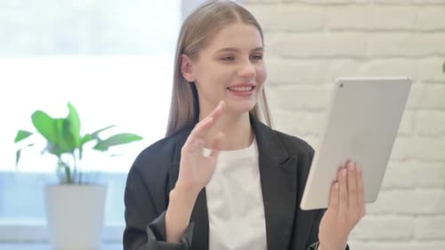 Woman in Blazer Uses Tablet for Video Call
