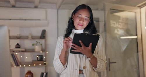 Happy business woman, tablet and night in office for planning web research