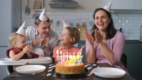 Happy Family Celebrating Birthday Together at Home