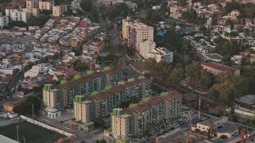 Stunning Aerial View of Malaga Cityscape at Sunset Showcasing Urban Architecture