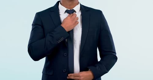 Fashion, suit and tie with a business man getting ready closeup in studio on a white background