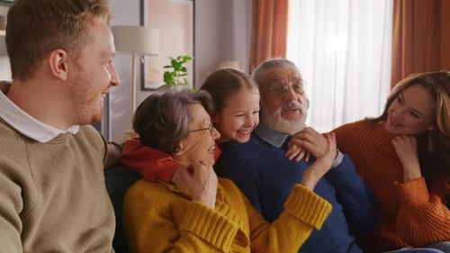 Happy Family Together on Comfortable Couch at Home