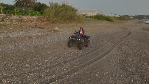 Coastal ATV Joy Aerial View of Girl's Ride and Relaxation