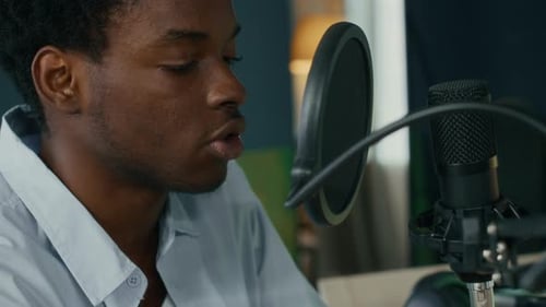 Sound Producer Singing in Microphone Working at Home Studio