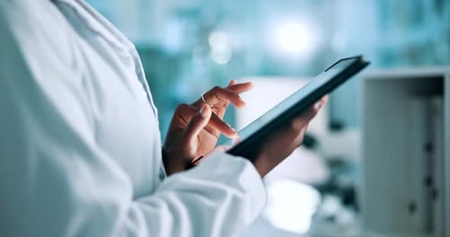 Hands Using Tablet in Scientific Workplace Close Up