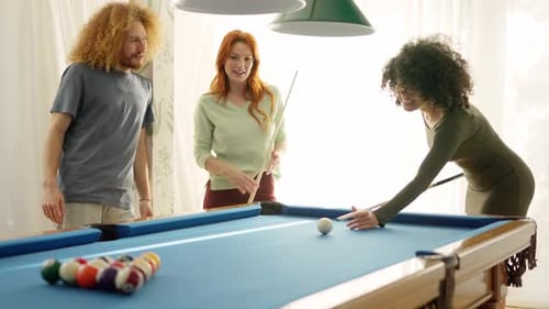 Woman Applauding a Friend While Playing Pool