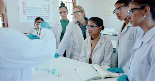 Classroom, university and professor with students, chemistry and research with conversation