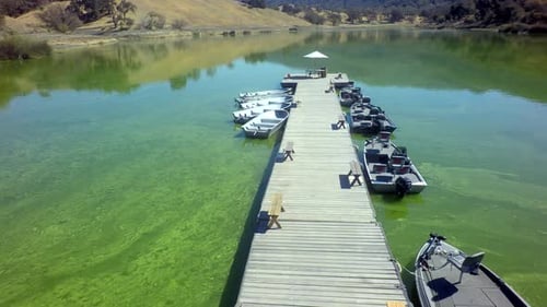 View of Gorgeous Mountainside Lake on Sunny Day by Aerial Drone Above